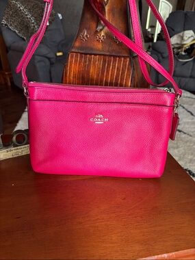 Coach Crossgrain Leather East West Swingpack bright pink/fuchsia color.